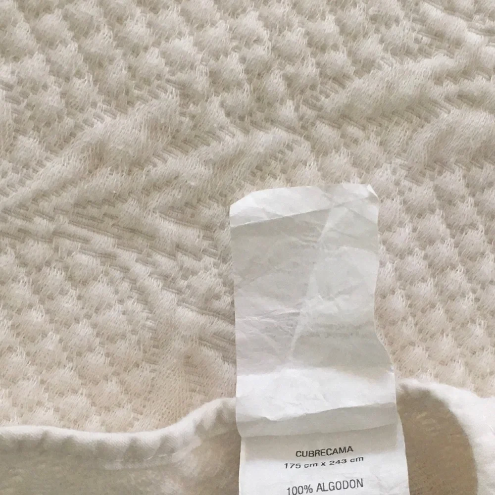 white matelassé coverlet